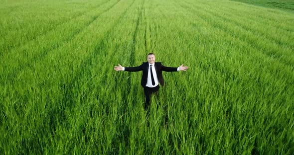The Agronomist Checks the Growth of the Young Barley Crop alt