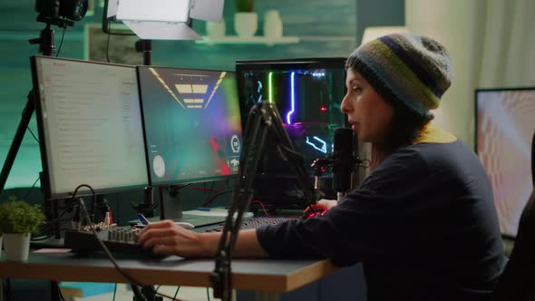 Professional Woman Streamer Playing FPS Games Talking Into Microphone alt