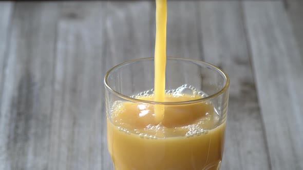 Pouring Orange Juice in the Morning alt
