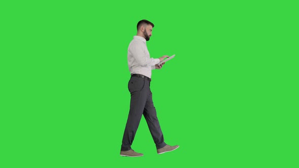 Serious Young Male Executive Using Digital Tablet Looking To Camera Agreeing Green Screen Chroma Key alt