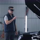 Mechanic in VR Glasses Diagnosing a Car - VideoHive Item for Sale