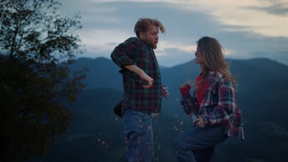 Excited Travelers Dance Sunset Outdoors on Holiday Closeup alt