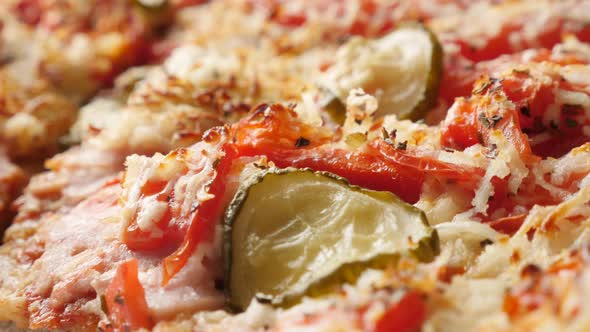 Panning over dinkel or hulled wheat gluten-free  vegetarian tasty pizza surface 4K 2160p 30fps Ultra alt