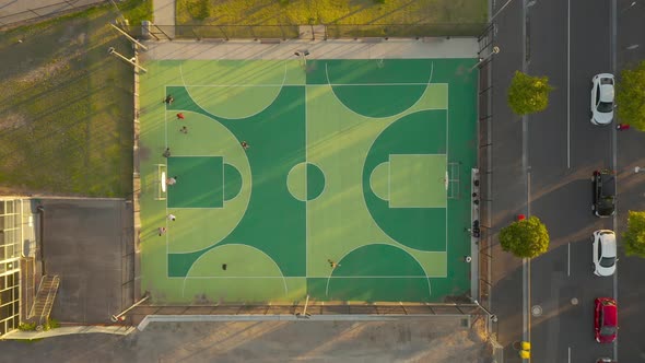 Local basketball team running beep test on outdoor basketball court. alt