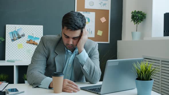 Sleepy Employee Napping at Desk Then Waking Up and Working with Cpmputer Typing alt