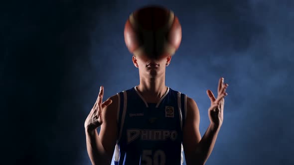 Portrait of Young African American Basketball Player in Dark Smoky Studio Under Spotlight alt