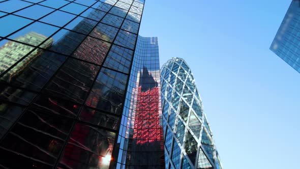 Business district building with wall mirror with blue sky alt