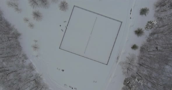 Infrastructure for Outdoor Activities Healthy Lifestyle Empty Sports Ground in a Winter Park Forest alt
