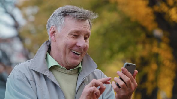 Joyful Elderly Man Making Video Call Use Modern Smartphone Mature Smiling Grandpa Holding Mobile alt