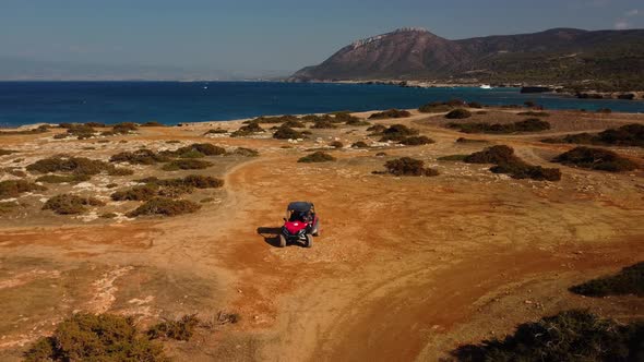 Aerial view of buggy car on the sandy on the sea coast of Cyprus or Greek in summer