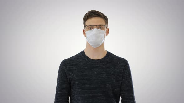 Student in Antiviral Mask Walking on Gradient Background alt