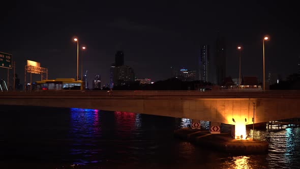 Lights of Buildings at Skyline in Busy Big City at Night alt