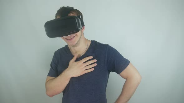 Man Uses A Modern Helmet Of Virtual Reality