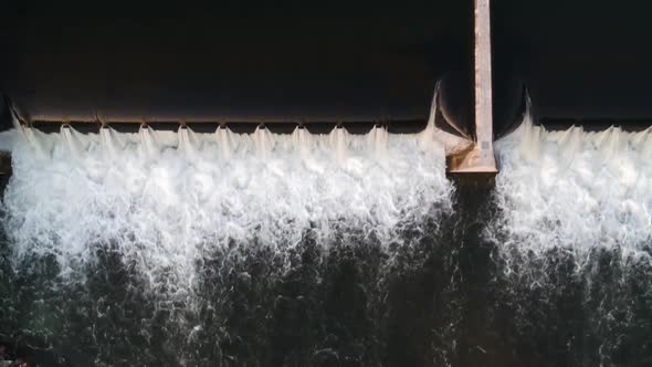 Flowing Water Water Mill Waterfall at Hydroelectric Electric Power Plant, Aerial Top Down alt