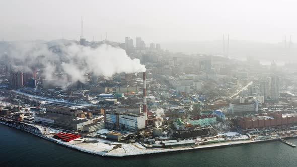 Aerial Video on the Chimney of an Power Plant From Which White Smoke Comes Out alt