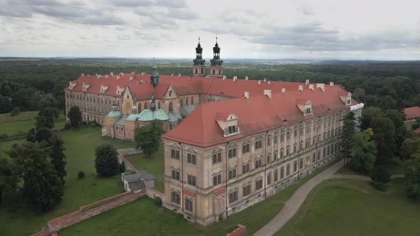 Aerial drone view of monastery complex in Lubiąż, Poland, the largest Cistercian abbey in the world. alt