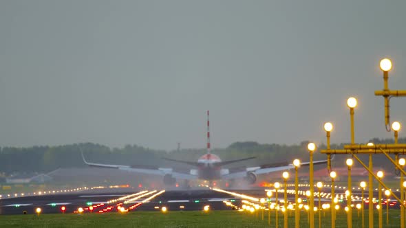 Airliner Landing on the Runway After Landing in a Rainy Weather alt