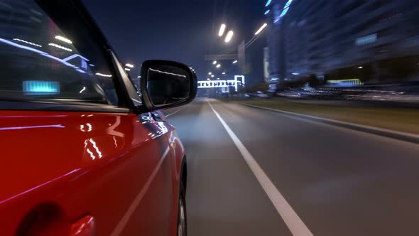 Drivelapse Urban Look From Fast Driving Car at a Night Avenue in a City Timelapse Hyperlapse alt