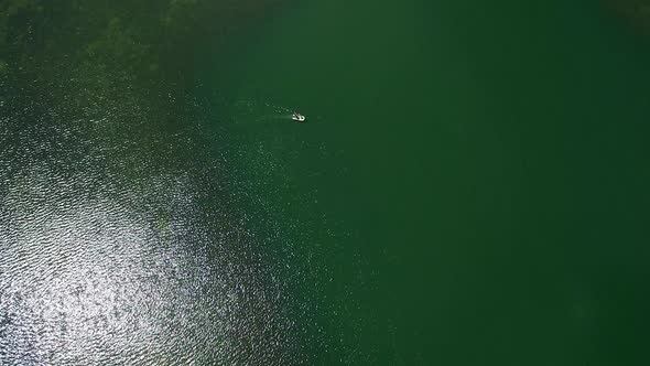 Descending view of a boat on Lyman Lake alt