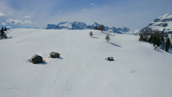 Aerial, Winter Landscape And Huge Mountain Peaks In Dolomites Mountains On A Sunny Day In Italy