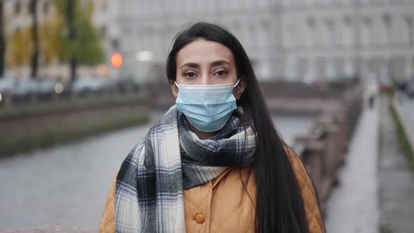 Pandemic Portrait of a Young Middle Eastern Woman Wearing Protective Mask on Street