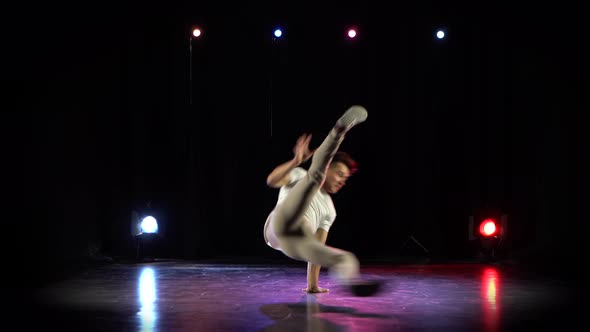 Trendy Young Man Dancing Single in Club, Neon Light, Lots of Smoke. Fashion Street Wear. alt