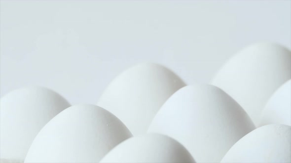 Eggs in a Carton Spinning White Chicken Eggs in a Carton