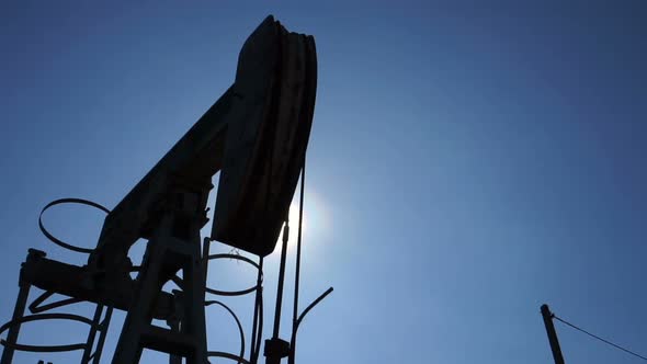 pumpjack at an oil drilling site, motorized slider shot