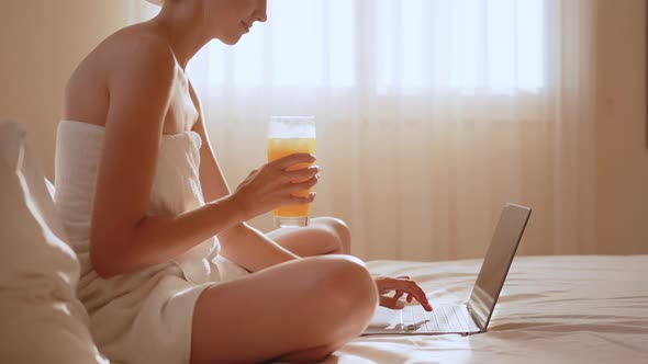 Young Woman Having Breakfast in a Modern Hotel Apartment alt