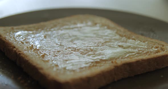 Honey on toast breakfast slow motion