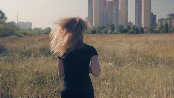 Runner Workout On Grass Field.Triathlete Run Before Triathlon Competition. Marathon Jogging On Trail alt