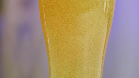 Cold Light Beer in a Glass on a Bluish Blurred Background alt