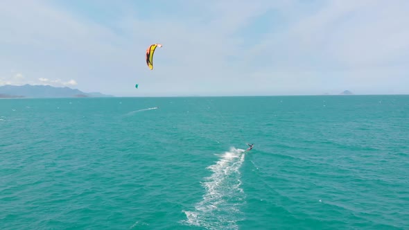 Acrobatic Jump of Professional Kite Surfer on the Sea Wave, Athlete Showing Sport Trick Jumping  alt