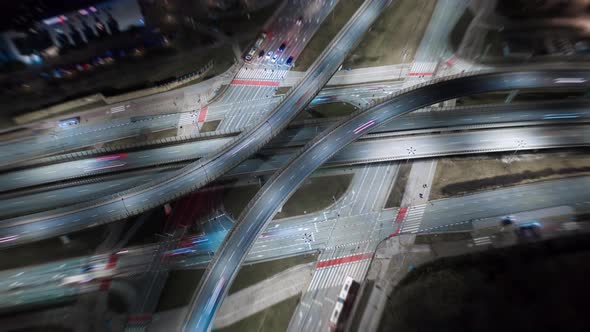 Aerial Time Lapse Traffic Jam Interchange Road at Night Drone Shot Top View Roadway Intersection in alt