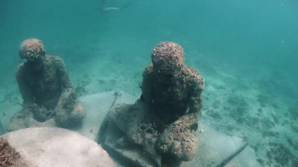 View of Multiple Statues Under Water in the Carribian