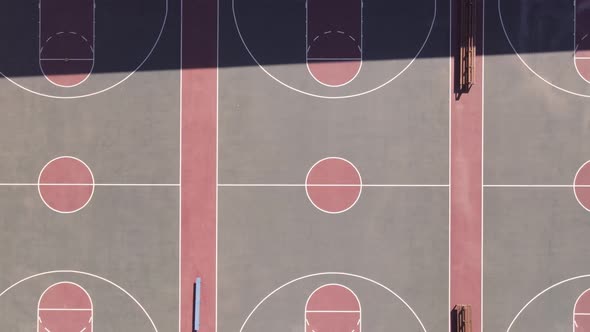 Drone Panning Away From a Row of Basketball Courts