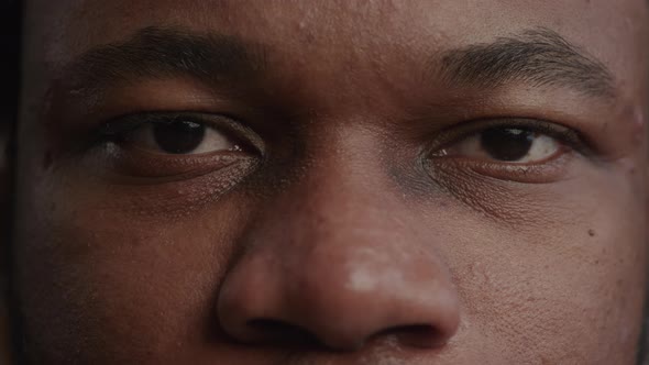 Extreme Closeup of a Black Man's Eyes Opening in Slow Motion, Stock Footage