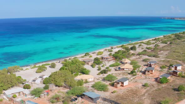 Aerial reverse over Eco Del Mar beach camping, Pedernales. Dominican Republic alt