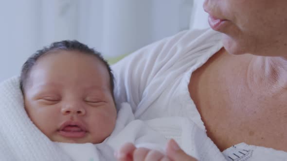 Mother and newborn baby in hospital alt