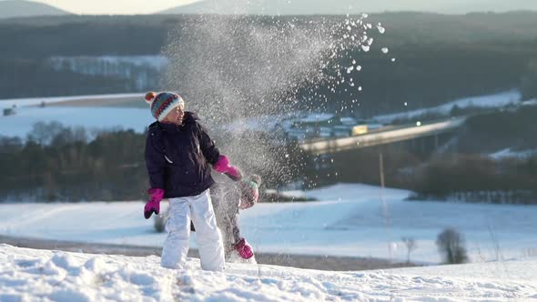 Slow Motion Young Girls Playing With Snow alt