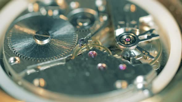 Clockwork Drive with Metal Gears and Cogs Moving Inside alt