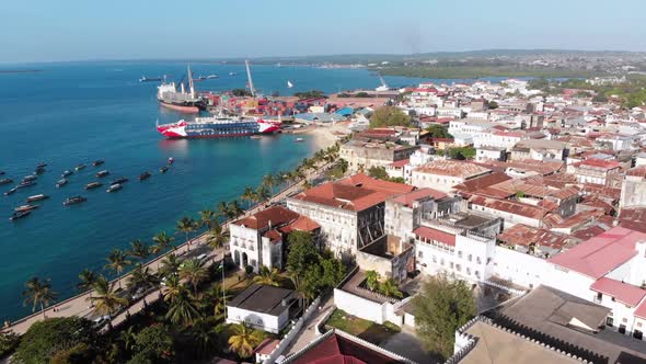 Aerial Waterfront and Seaport of Stone Town Anchored Boats in Ocean Zanzibar alt