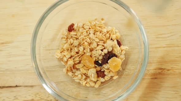Pouring Muesli Breakfast Mix in Bowl alt