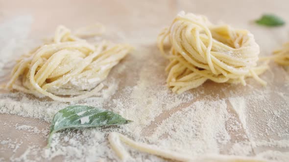Home Made Pasta on the Table with Flour alt