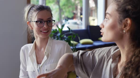 Smiling Students Discussing New Project in Library Closeup alt