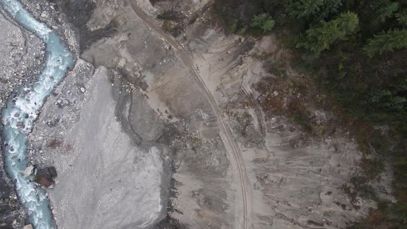 Marsyangdi River flowing at the base of a landslide in Nepal alt