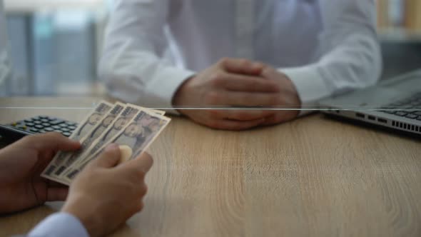 Bank Cashier Refusing to Change Japanese Yen, Currency Exchange Limitations alt