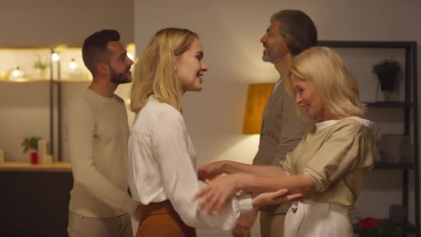 Young Couple Greeting Parents alt