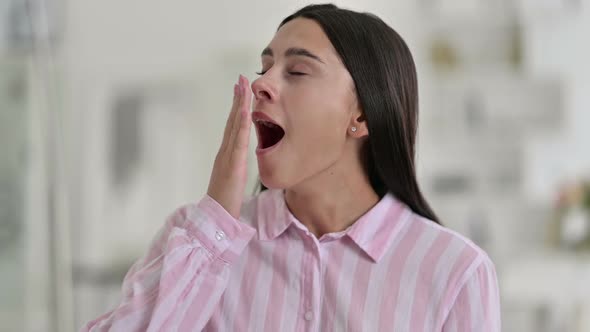 Portrait of Sleepy Young Latin Woman Yawning alt
