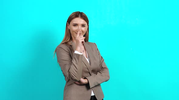 Young Woman with Brown Hair with a Smile on Her Lips, in a Business Suit alt